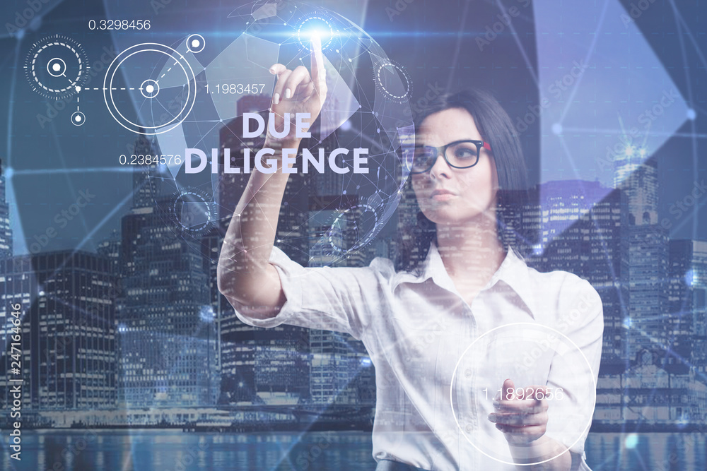 The concept of business, technology, the Internet and the network. A young entrepreneur working on a virtual screen of the future and sees the inscription: Due diligence The concept of business, technology, the Internet and the network. A young entrepreneur working on a virtual screen of the future and sees the inscription: Due diligence