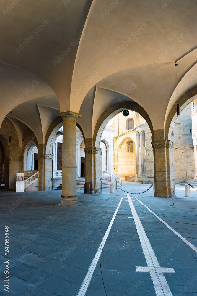 Archways View of portico in front of the Palazzo della Ragione, Citta Alta, Bergamo, Italy.