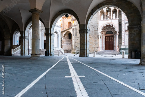Photo Archways View of portico in front of the Palazzo della Ragione, Citta Alta, Bergamo, Italy