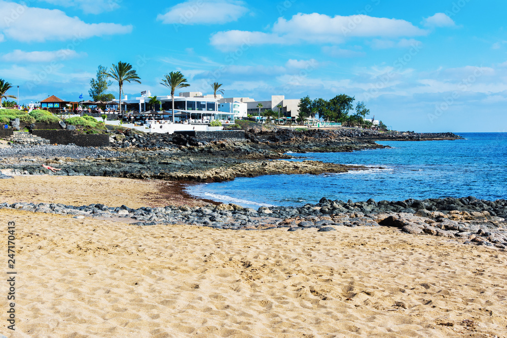 View of Playa Bastian beach in Costa Teguise, Lanzarote, Spain, clear turquoise waters, selective focus View of Playa Bastian beach in Costa Teguise, Lanzarote, Spain, clear turquoise waters, selective focus
