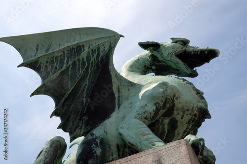 Dragon - symbol of the Slovenian capital on the Dragon Bridge in Ljubljana, Slovenia  photo