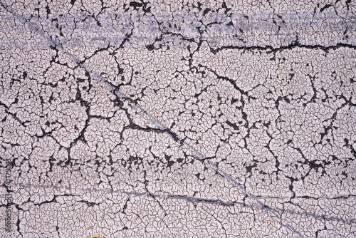 close up of cracked paint on the street for backgrounds