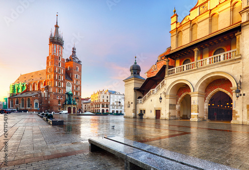 Old city center view with Adam Mickiewicz monument and St. Mary's Basilica in Krakow on the morning photo