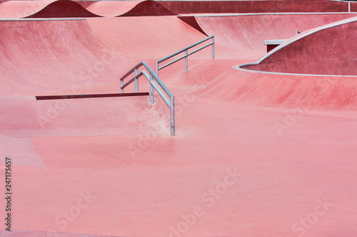 Red platform for riding people on skateboard and roller skates in city park. photo