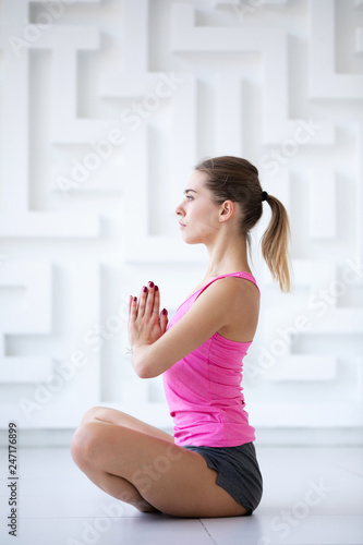 Sporty woman in the lotus position.