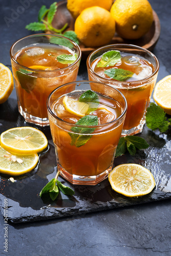 refreshing iced tea with mint and lemon, vertical, top view