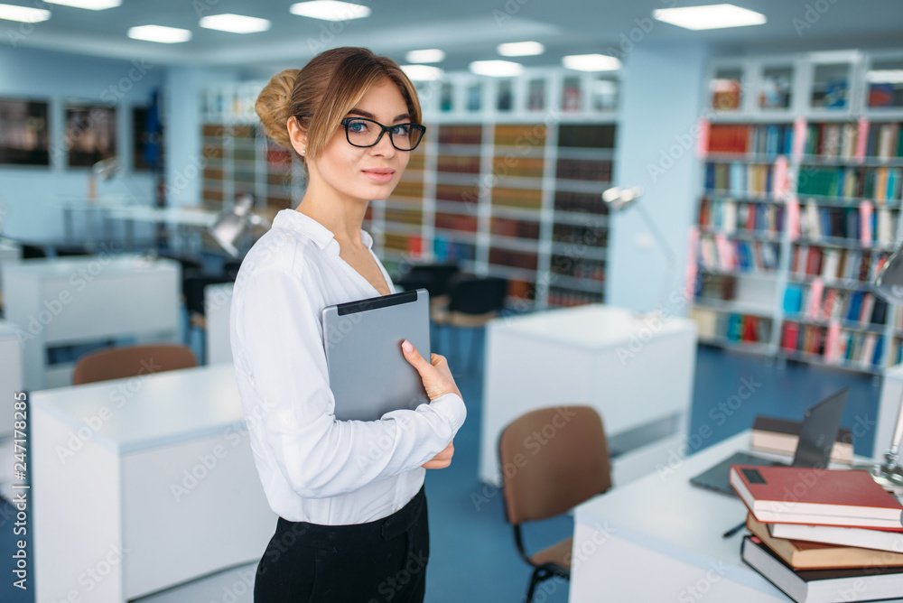 Female person standing in university library Female person standing in university library