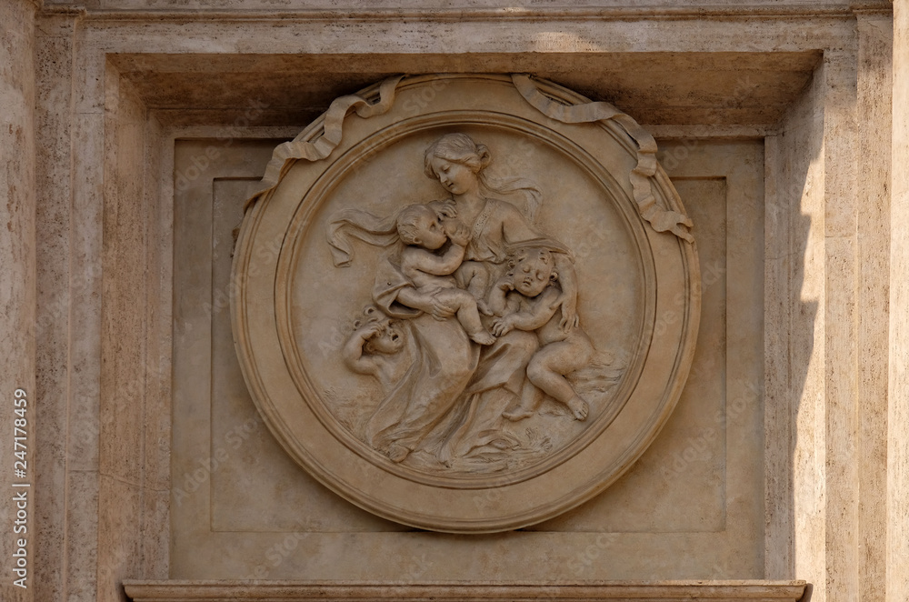Charity Medallion on the Palazzo Montecitorio, seat of the Italian Chamber of Deputies in Rome, Italy 