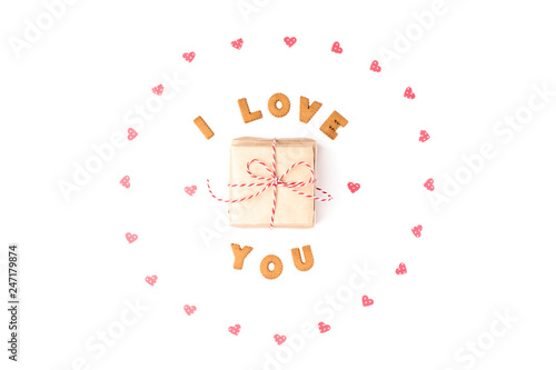 Valentine's day concept. Declaration of love, frame made of paper hearts. In the center gift in craft paper. Flat lay, top view, white background, isolated, copy space