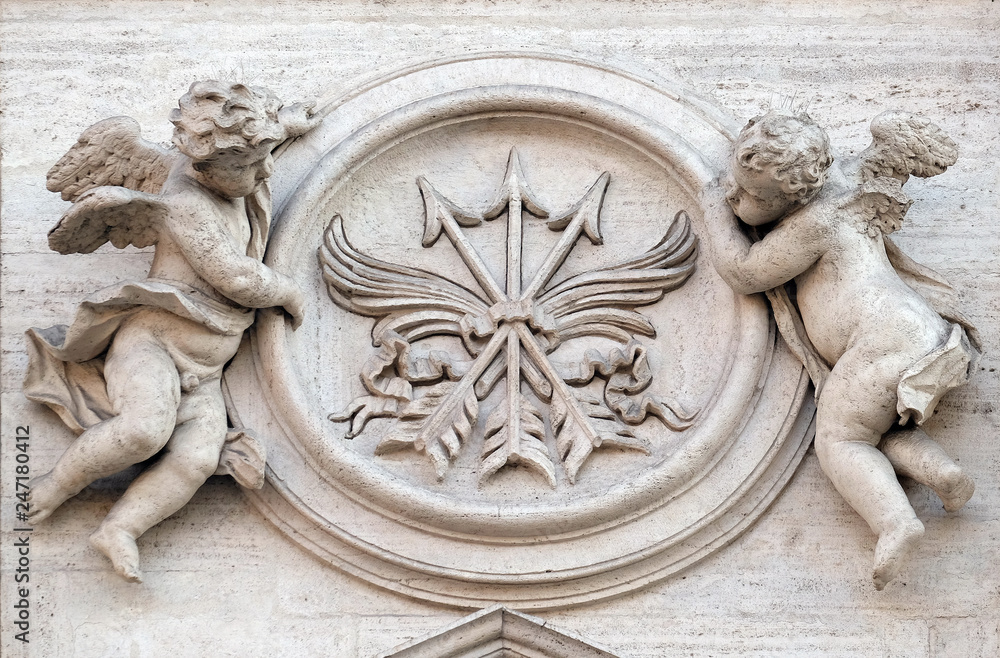 Angels with symbols of martyrdom on the portal of Sant Andrea della Valle Church in Rome, Italy 