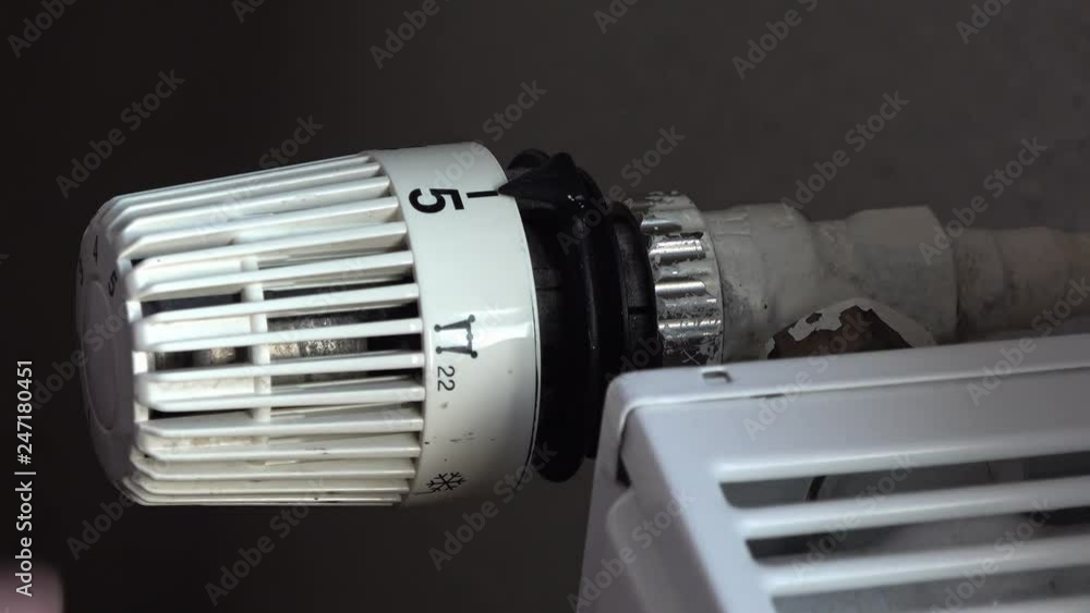 Technician repairing heating Thermostat pliers Technician repairing heating Thermostat pliers