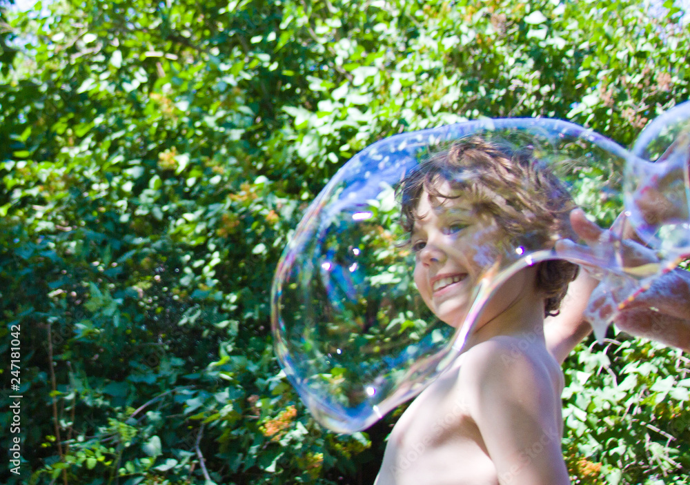 children's entertainment. a child with a huge bubble children's entertainment. a child with a huge bubble
