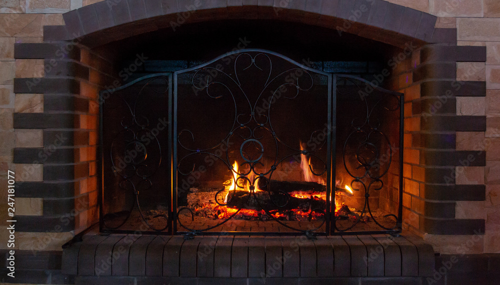 A glowing fire in the stone fireplace
