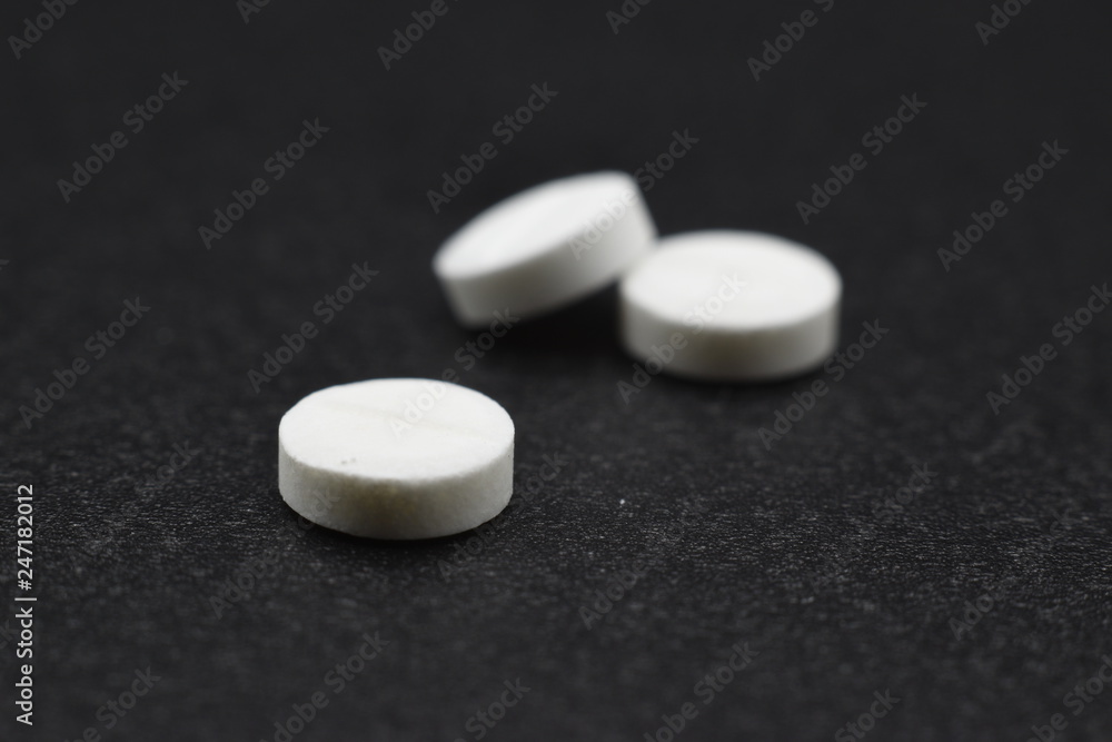 three tablets for medical use photographed in macro three tablets for medical use photographed in macro