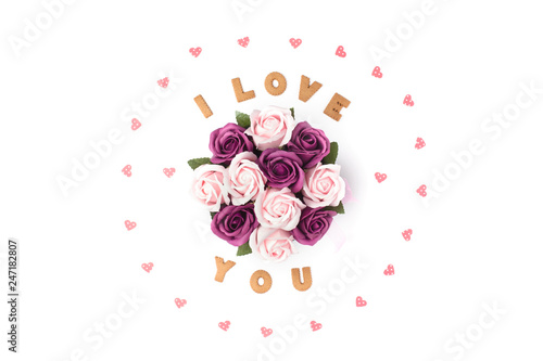 Valentine's day concept. Declaration of love, frame made of paper hearts. In the center flowers in a box. Flat lay, top view, white background, isolated, copy space