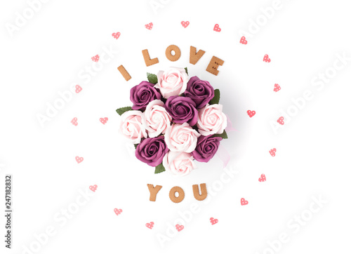 Valentine's day concept. Declaration of love, frame made of paper hearts. In the center flowers in a box. Flat lay, top view, white background, isolated, copy space