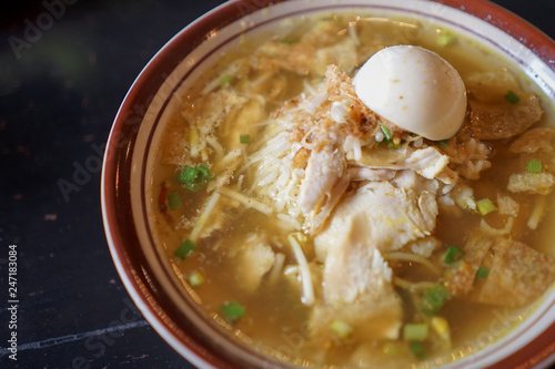 Chicken Soto, traditional Indonesian meat soup with many seasoning