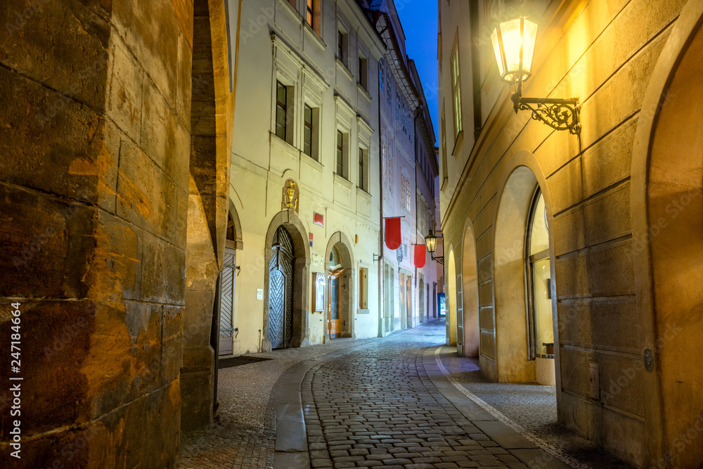 Old Historic Prague street at night with old lamps