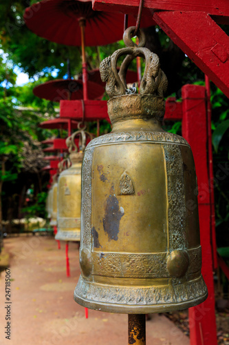 Row of bells in a buddhist temple of Thailand