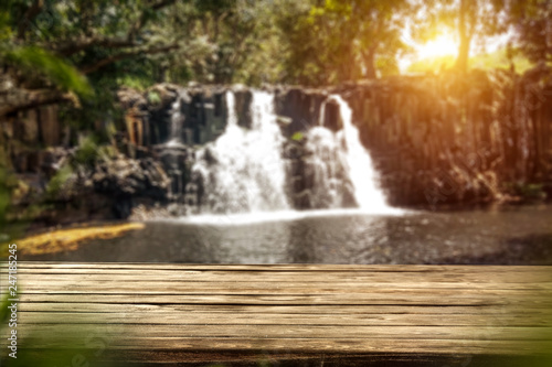 desk of free space and waterfall background 