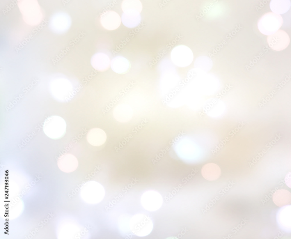Obraz premium Blurred lights bokeh on soft beige background.