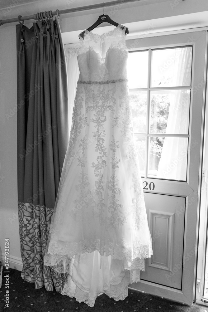 Wedding dress hanging up before the ceremony Wedding dress hanging up before the ceremony