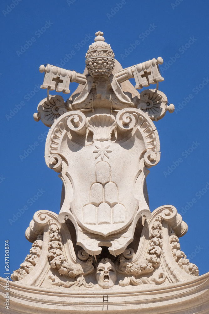Alexander VII Coat of Arms, fragment of colonnade of St. Peters Basilica. Papal Basilica of St. Peter in Vatican, Rome, Italy