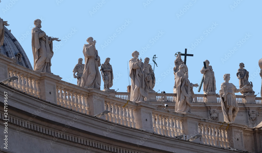 Obraz premium Gallery of saints, fragment of colonnade of St. Peters Basilica. Papal Basilica of St. Peter in Vatican - the world largest church, is the center of Christianity in Rome, Italy 