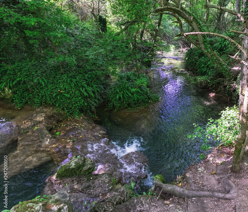 Nature landscape of Krushuna waterfalls in Bulgaria. The turquoise water of falls, terraces and pools photo