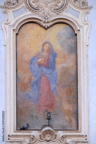 Image of Virgin Mary on the facade of a palace in Rome, Italy 