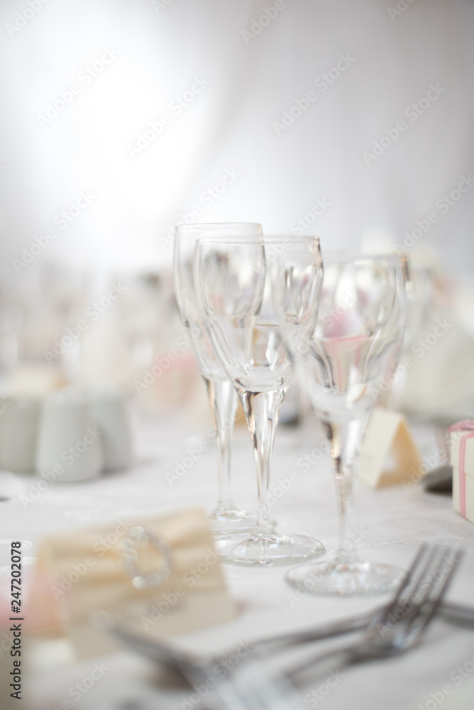 Wine glasses on a table during a wedding dinner Wine glasses on a table during a wedding dinner