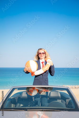 Successful young businesswoman on a beach