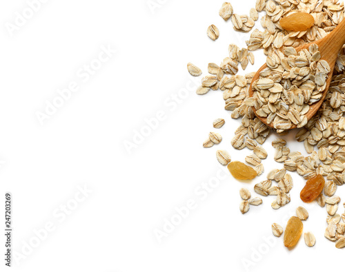 Oat flakes with wooden spoon on white background
