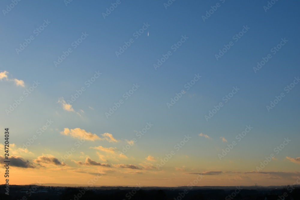 Panorama of the evening sky. Cloudy blue space space.