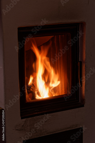 Flames in a wood burning stove in a house