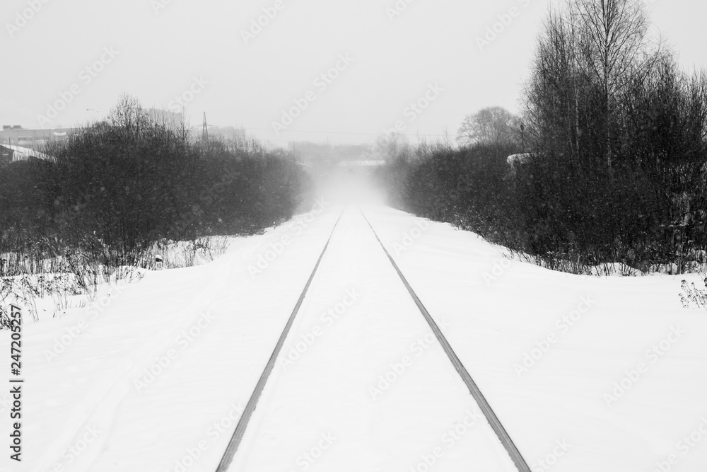 Obraz premium snow-covered railroad goes into the distance