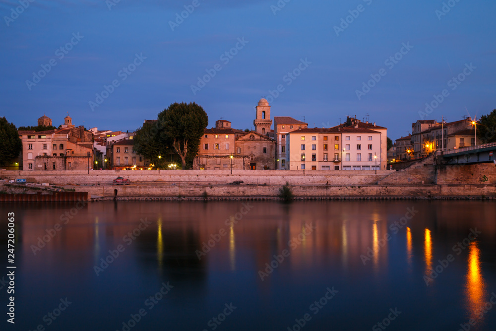 Arles, view to historic town from the river. Twilight, Arles, Provence-Alpes-Cote d'Azur, France.