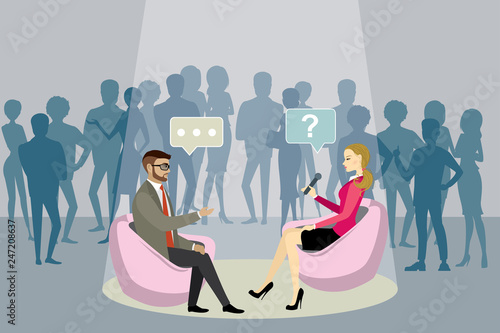  female reporter with microphone interviews a european businessman