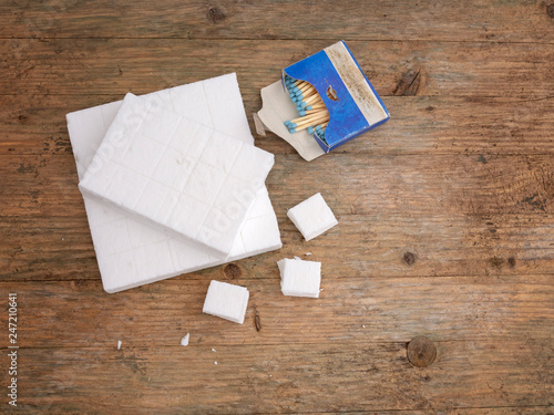 White firelighters for barbecue, open fire etc. Small, solid fuel tablets with matches. photo