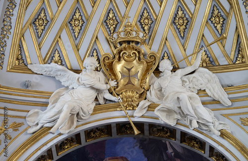 Statues of angels on the ceiling of Santissima Trinita degli Spagnoli Church in Rome, Italy  photo