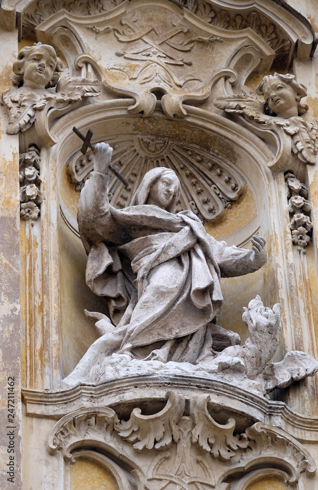Statue of Saint Martha of Bethany on facade of Santa Maria Maddalena Church in Rome, Italy Statue of Saint Martha of Bethany on facade of Santa Maria Maddalena Church in Rome, Italy
