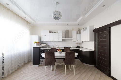 Interior. Kitchen modern, white, brown, beige color, doors