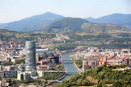 Bilbao desde las alturas, vista del río Nervion con sus puentes. A lo lejos sus verdes montañas.  photo