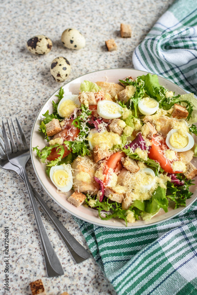 Fresh caesar salad with chicken breast, lettuce and tomatoes. Delicious spring salad Fresh caesar salad with chicken breast, lettuce and tomatoes. Delicious spring salad
