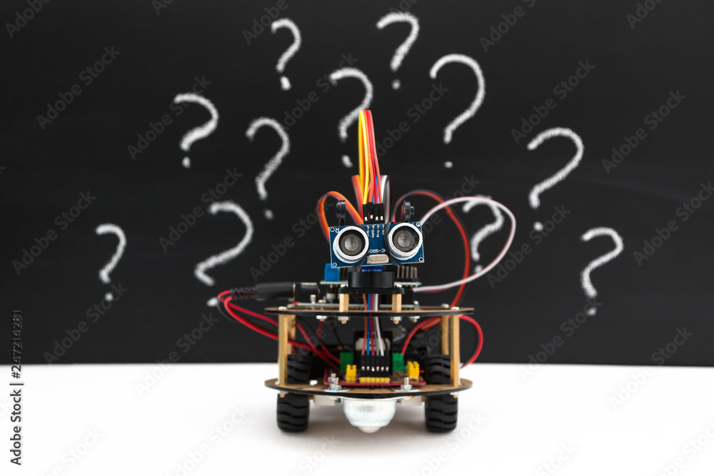 Hand made robot working on the arduino platform. White background. Free ...