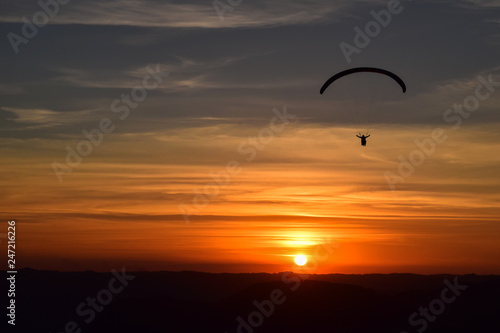 Paragliding on sunset