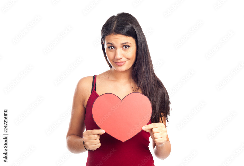 beautiful happy brunette woman holding and showing a big red heart beautiful happy brunette woman holding and showing a big red heart