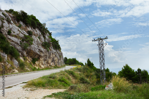 power line in the mountains near the road in Croatia