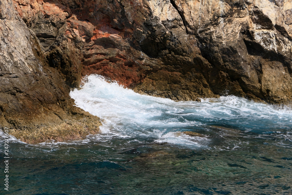 Rocky sea coast with the wave.