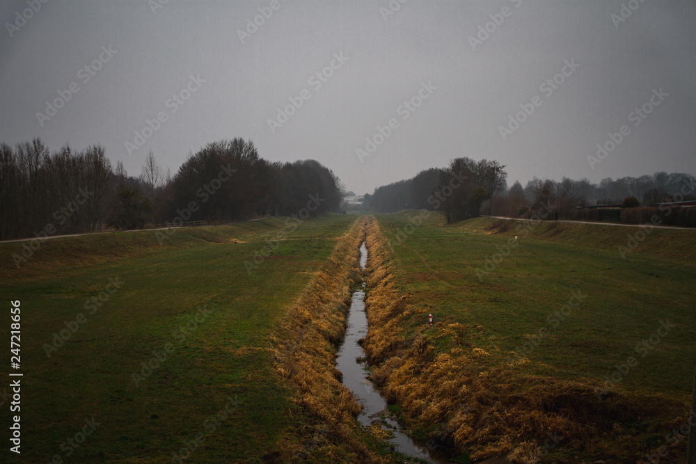 Riverbed in a foggy morning near the old town of Gottingen. Germany Riverbed in a foggy morning near the old town of Gottingen. Germany